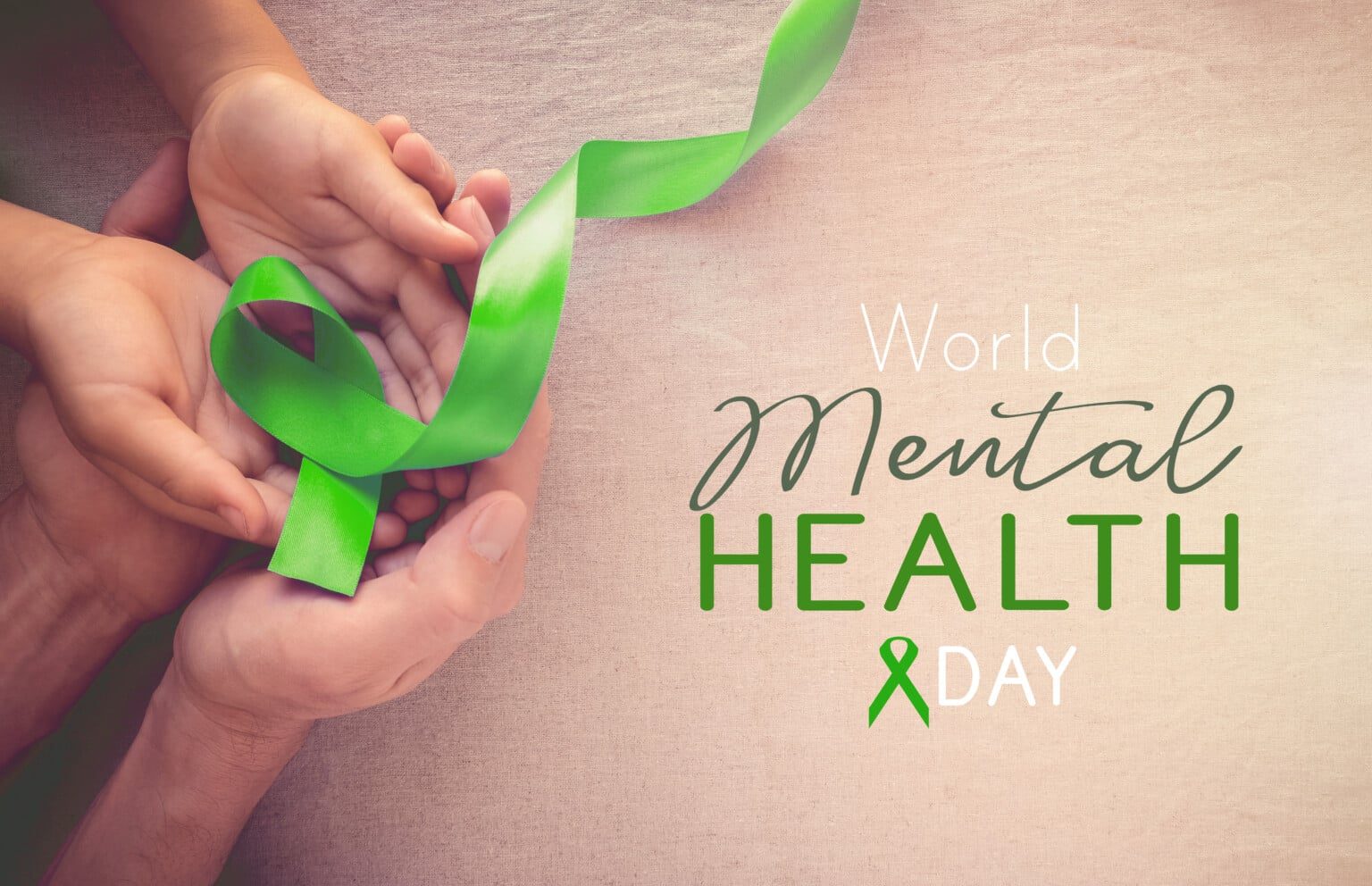 Adult and child hands holding Lime GreenRibbon, world Mental health day